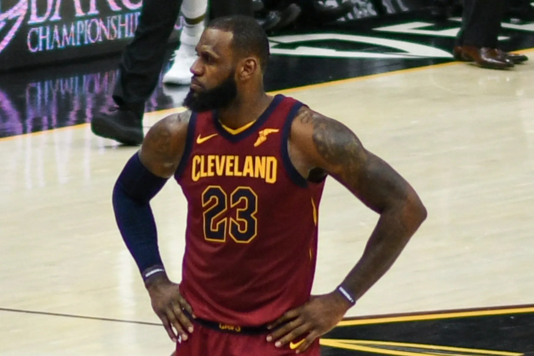 LeBron James standing on court in his number 23 Cleveland Cavaliers uniform.